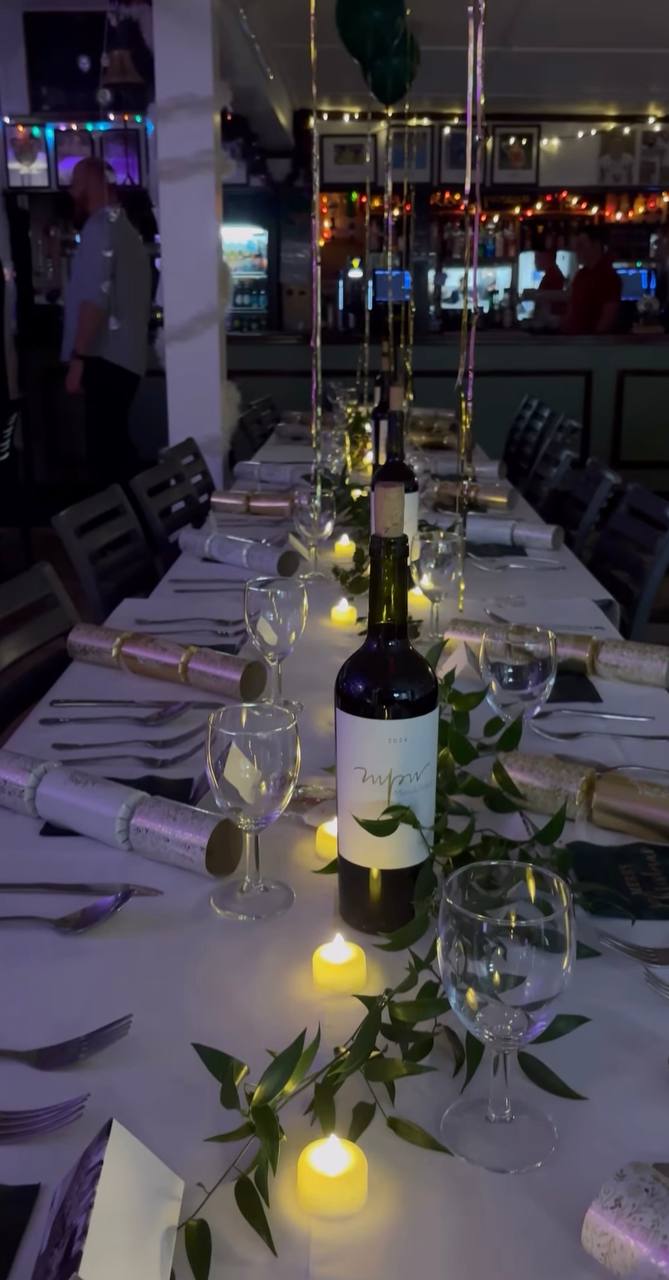 Long candlelit dinner table set for Bicycle London