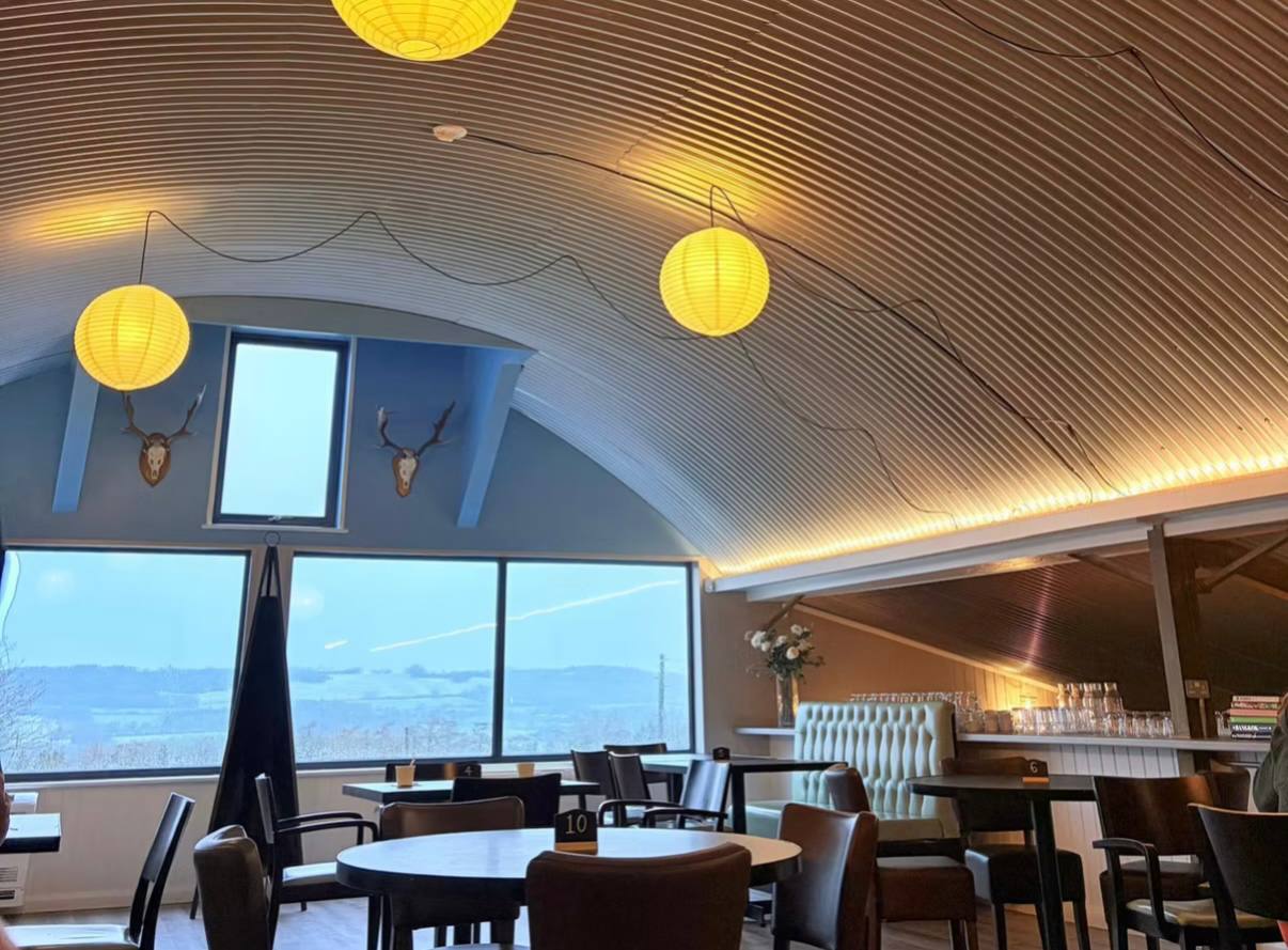 Dining room with vaulted ceiling and countryside views